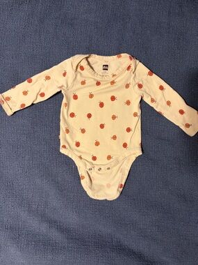 Tea Collection Cream Long-Sleeve One-Piece with Orange Ladybug Motif